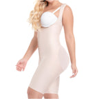 Woman wearing a beige body shaper over a white bra on a white background