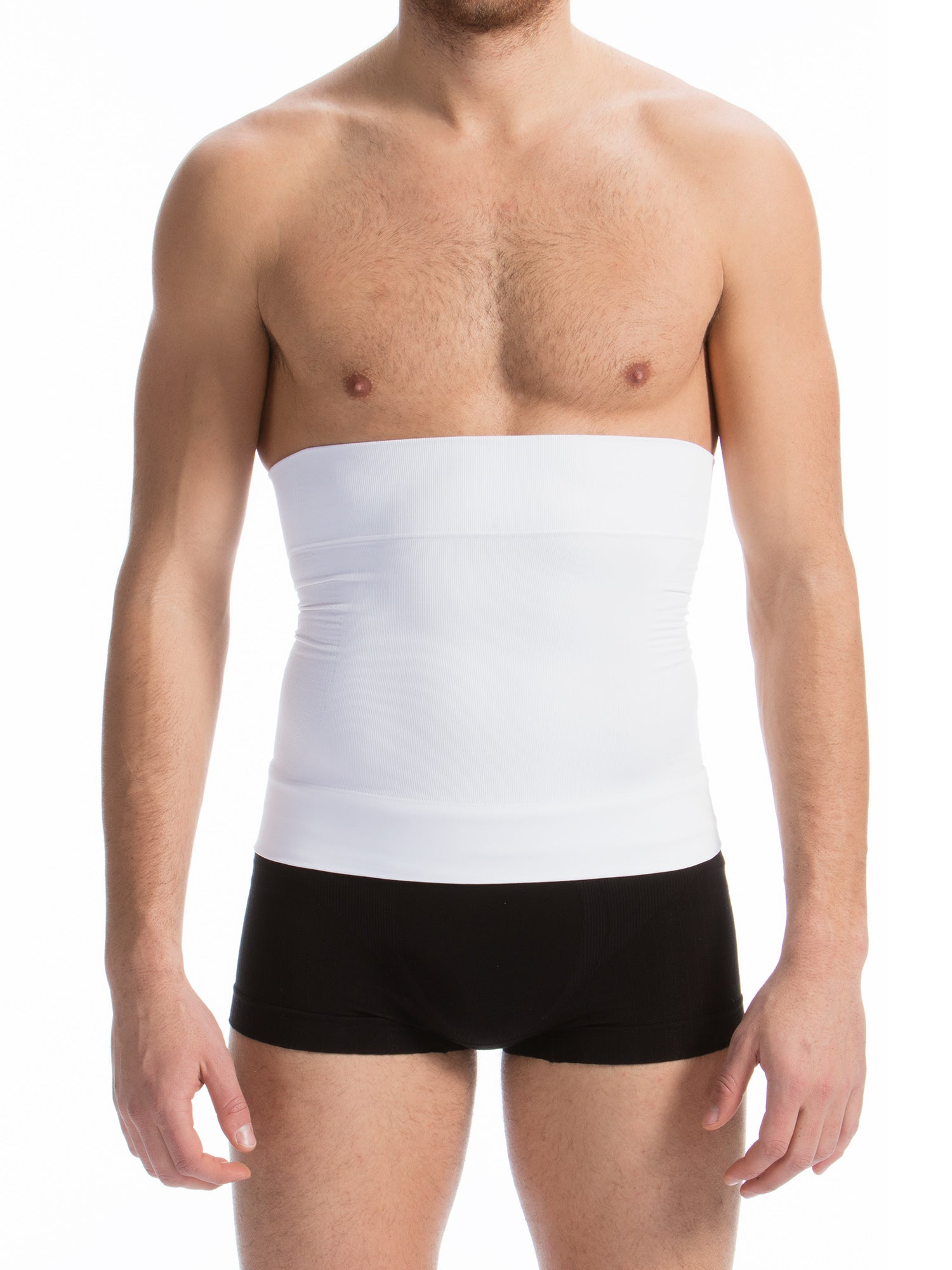Man wearing a white compression garment over black underwear on a white background