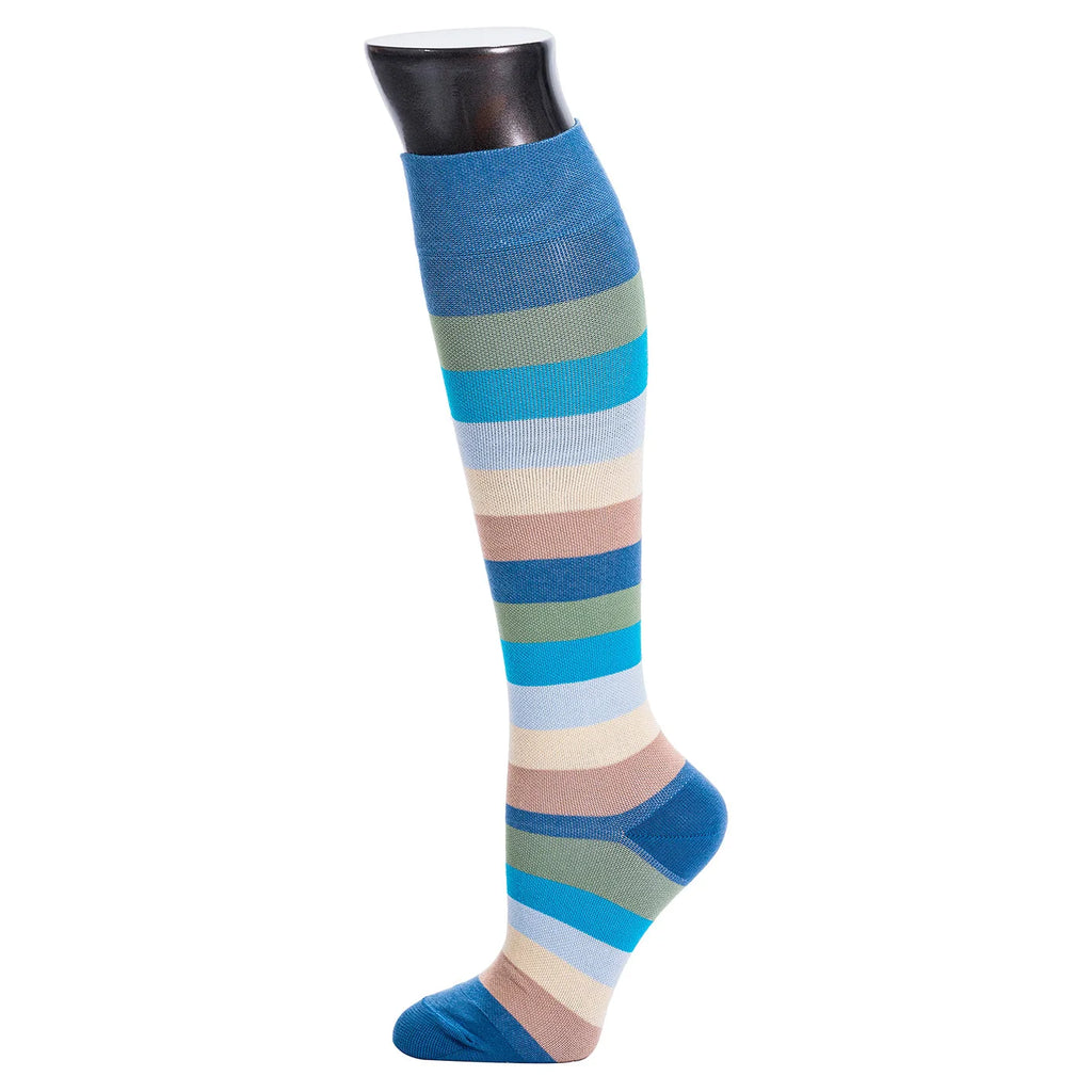 Colorful striped knee-high sock on a mannequin leg against a white background