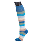 Colorful striped knee-high sock on a mannequin leg against a white background