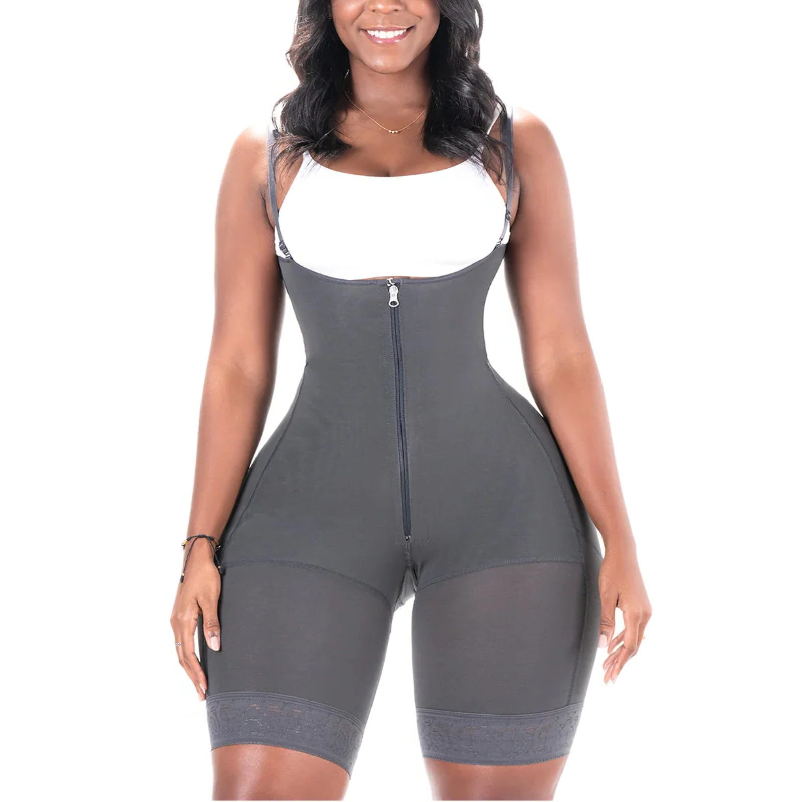 Woman wearing a gray and white bodysuit on a white background