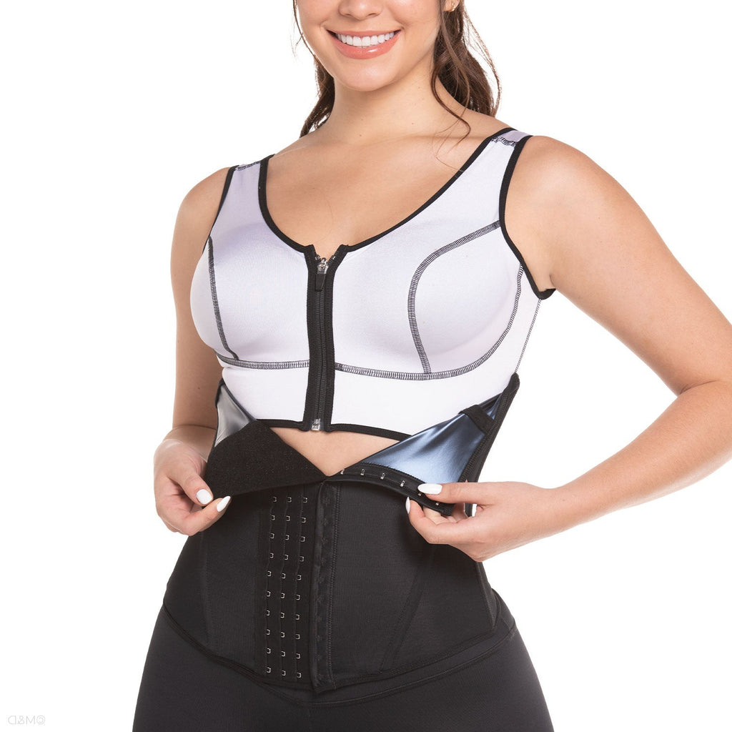 Woman wearing a black and white waist trainer on a white background