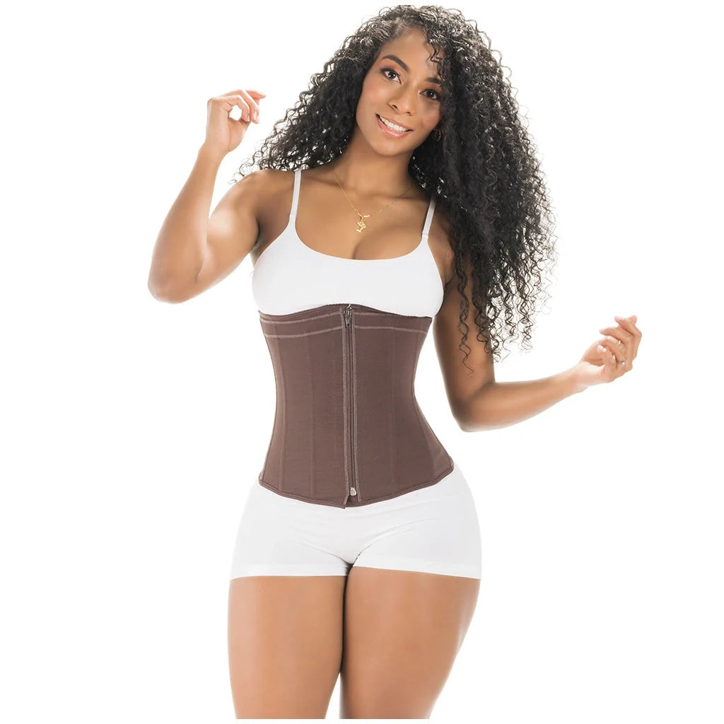 Woman wearing a brown waist trainer with a white tank top and shorts on a white background