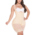 Woman wearing a beige shapewear bodysuit on a white background