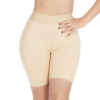 Beige shapewear shorts worn by a model on a white background