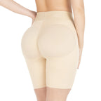 Beige shapewear shorts worn by a model on a white background