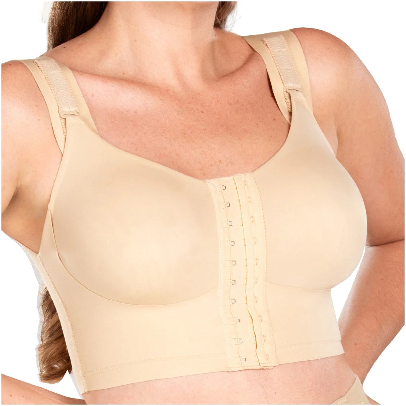 Beige compression garment worn by a person on a white background