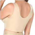 Beige tank top worn by a person on a white background