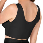 Black sports bra worn by a person on a white background