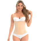 Woman wearing a beige waist trainer and white underwear on a white background