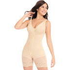 Woman wearing a beige shapewear bodysuit on a white background