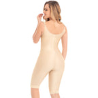 Woman wearing a beige bodysuit on a white background