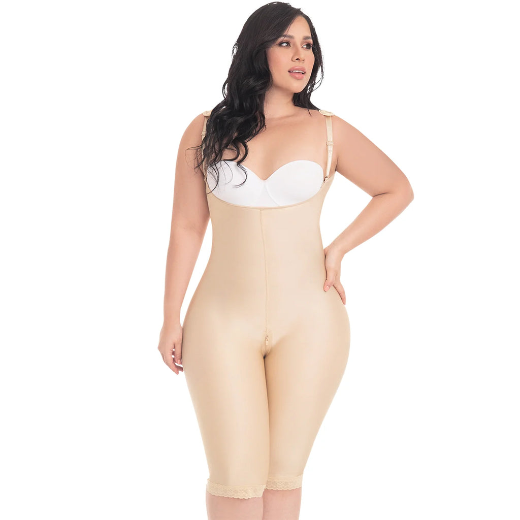 Woman wearing a beige shapewear bodysuit on a white background