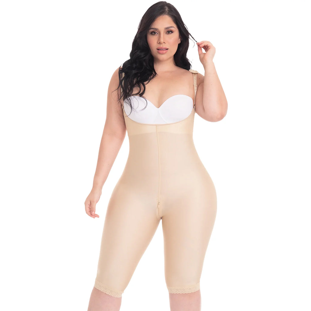 Woman wearing a beige shapewear jumpsuit on a white background