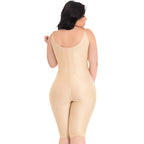 Woman wearing a beige shapewear bodysuit on a white background