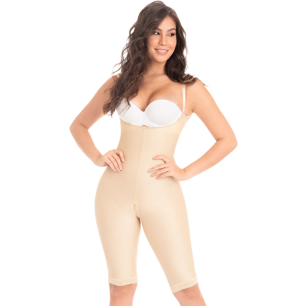Woman wearing a beige shapewear jumpsuit on a white background