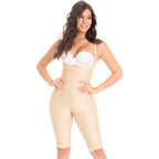 Woman wearing a beige shapewear jumpsuit on a white background