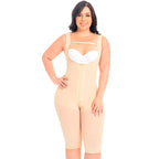 Woman wearing a beige overalls with a white bralette on a white background