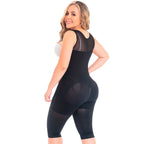 Woman wearing a black body shaper on a white background