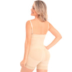 Woman wearing a beige shapewear garment on a white background