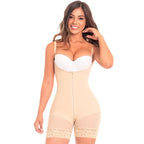Woman wearing a beige shapewear jumpsuit on a white background