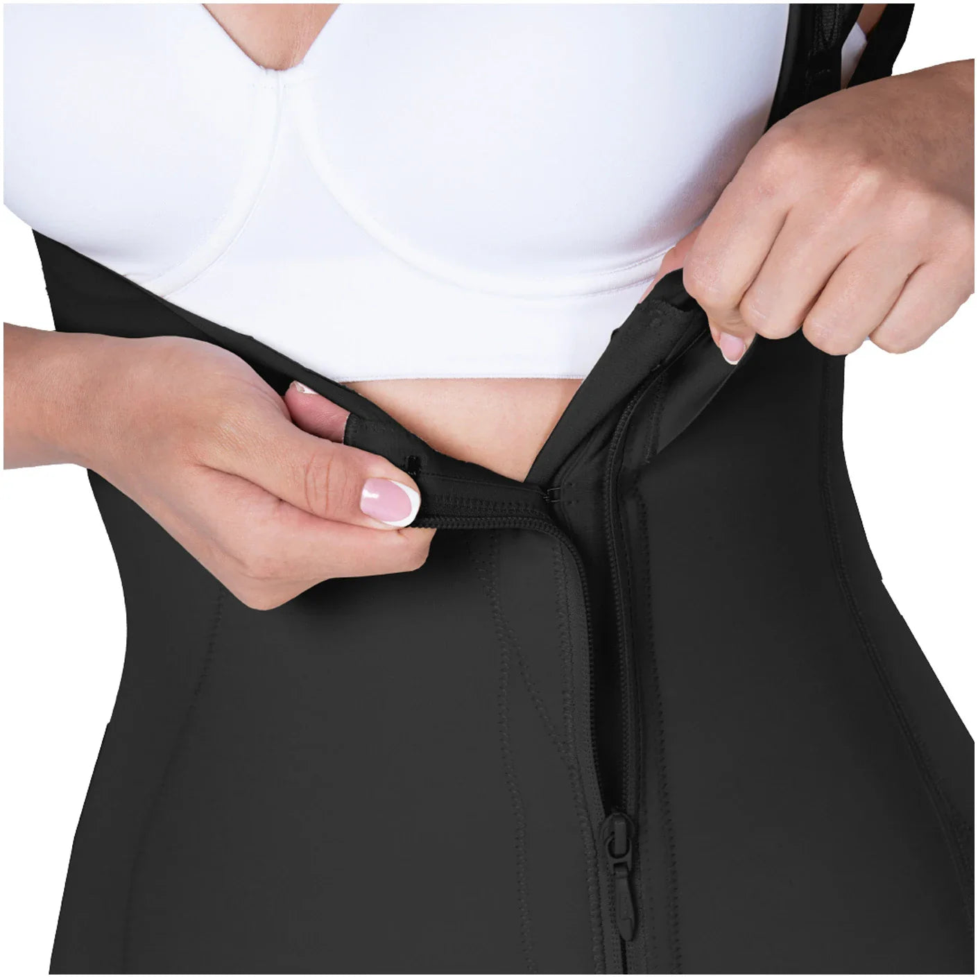 Person wearing a black waist trainer with a white background