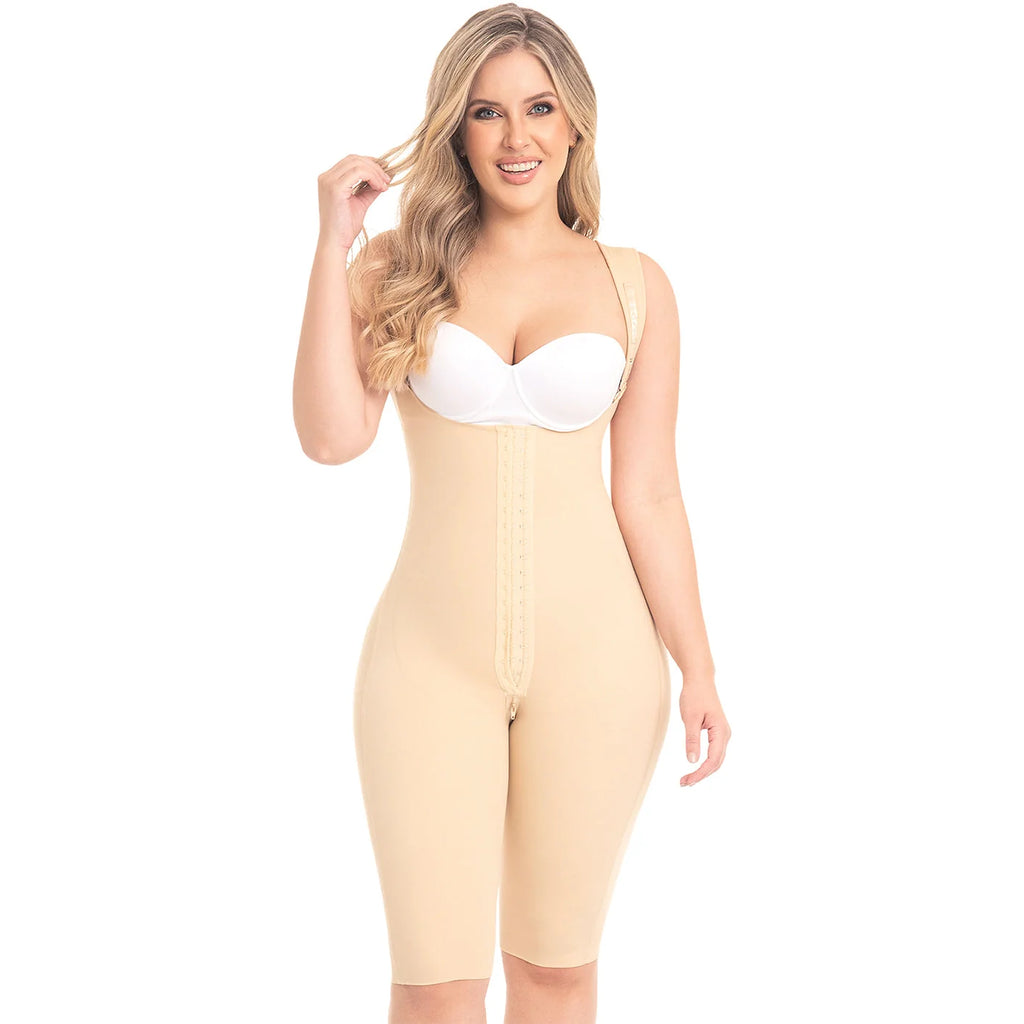 Woman wearing a beige shapewear jumpsuit on a white background