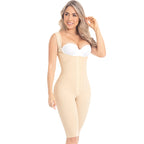 Woman wearing a beige shapewear garment on a white background