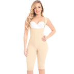 Woman wearing a beige body shaper over a white background