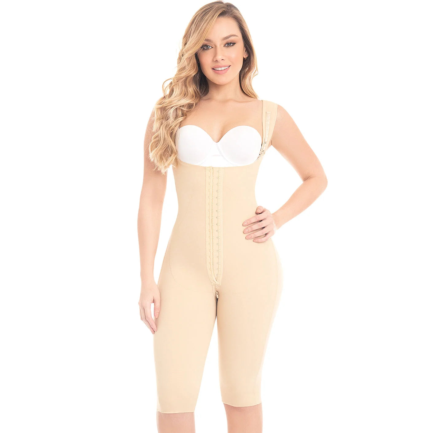 Woman wearing a beige body shaper over a white background