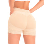 Beige shapewear shorts worn by a person on a white background