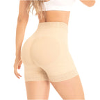 Beige shapewear shorts worn by a person on a white background