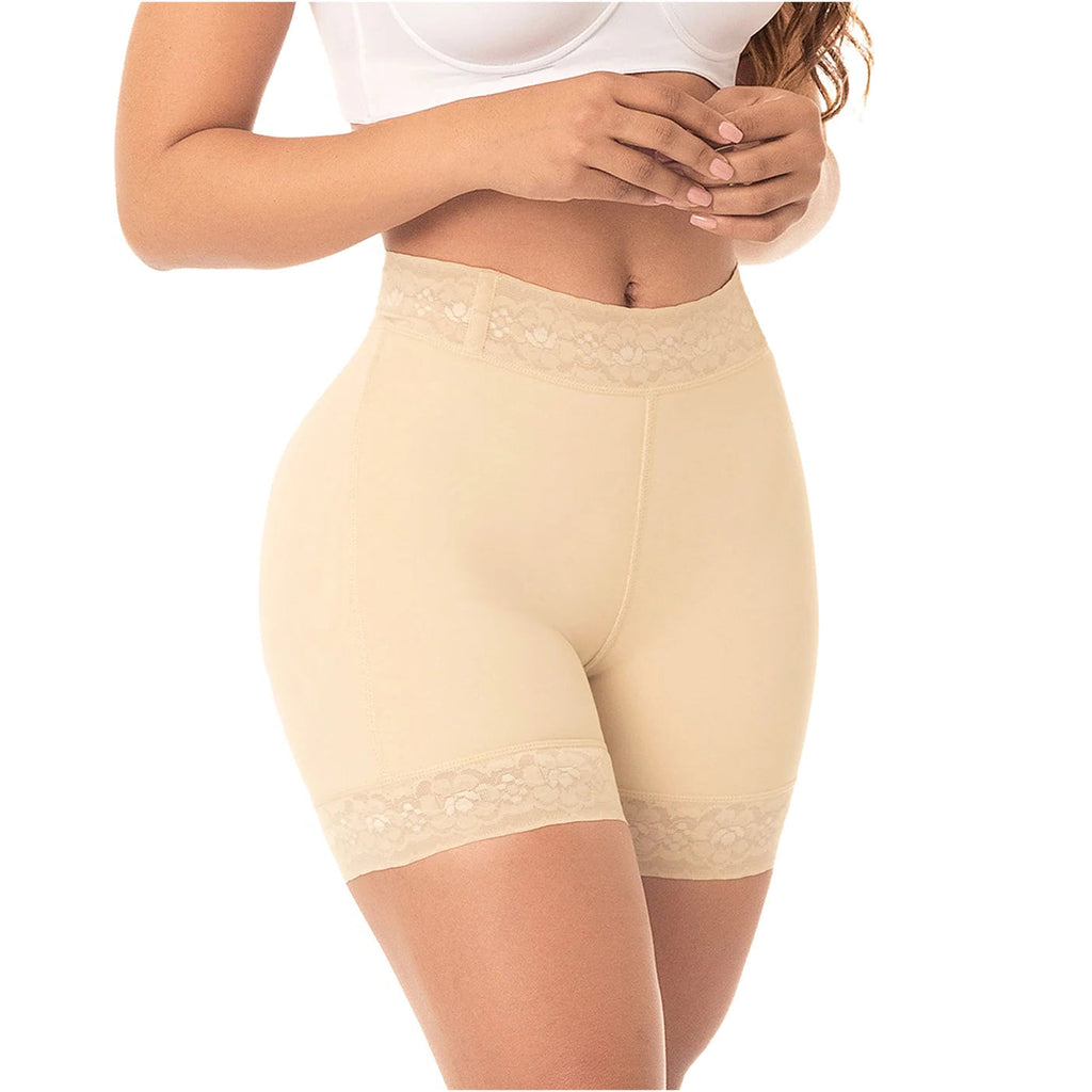 Beige shapewear shorts worn by a person on a white background