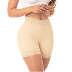 Beige shapewear shorts worn by a person on a white background