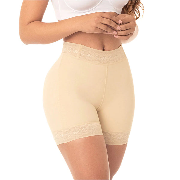 Beige shapewear shorts worn by a person on a white background