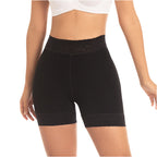 Black shorts worn by a person on a white background