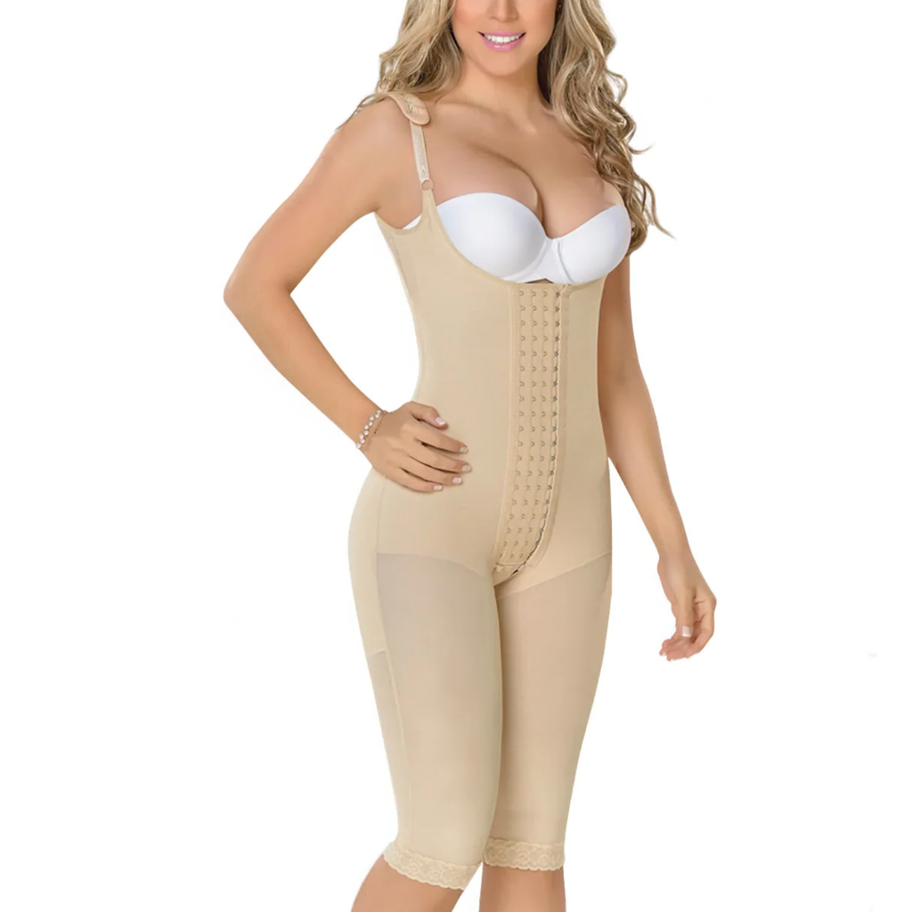 Woman wearing a beige shapewear garment on a white background