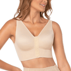 Woman wearing a beige compression garment on a white background