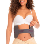 Woman wearing a gray M&D waist trainer on a white background