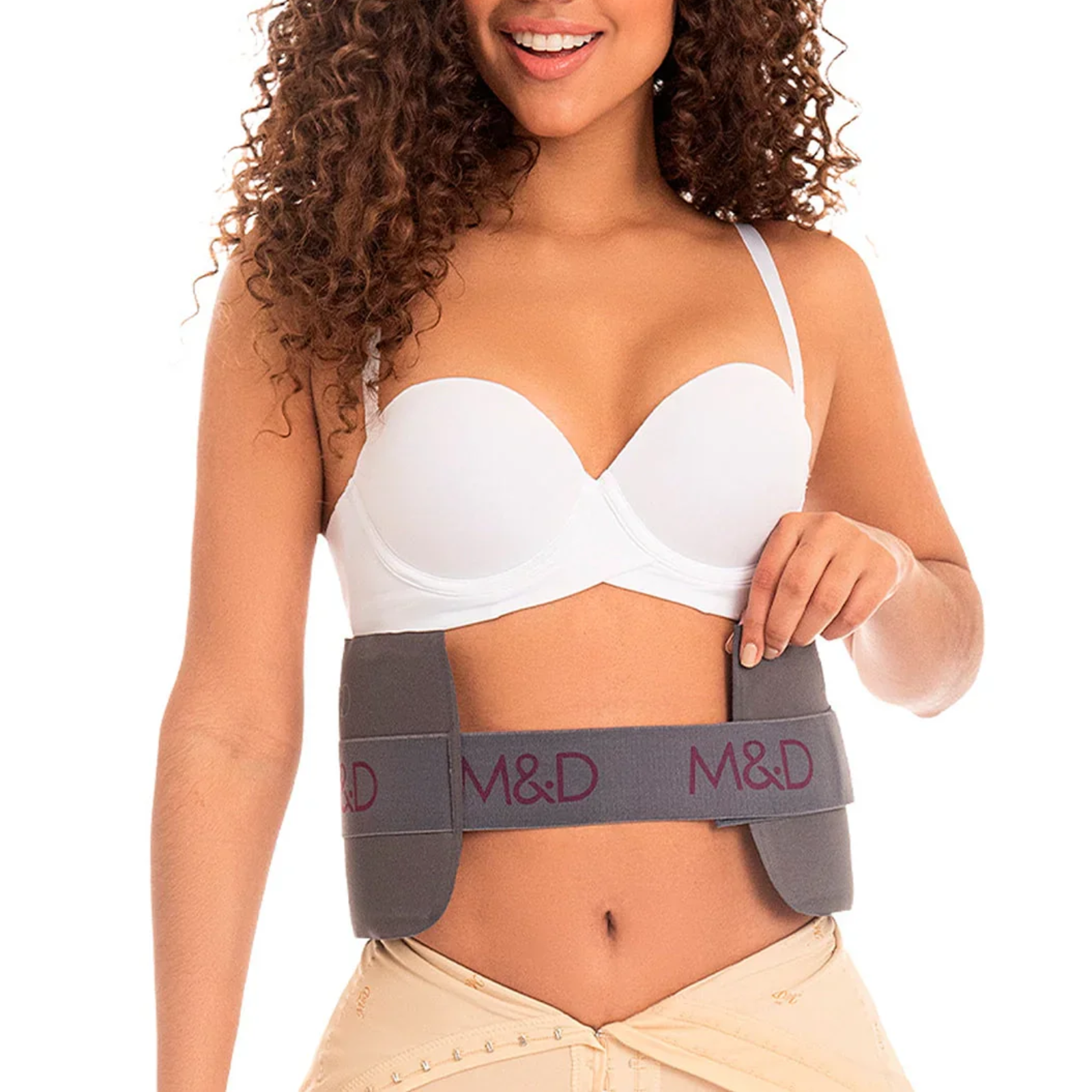 Woman wearing a gray M&D waist trainer on a white background