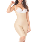Woman wearing a beige shapewear bodysuit on a white background