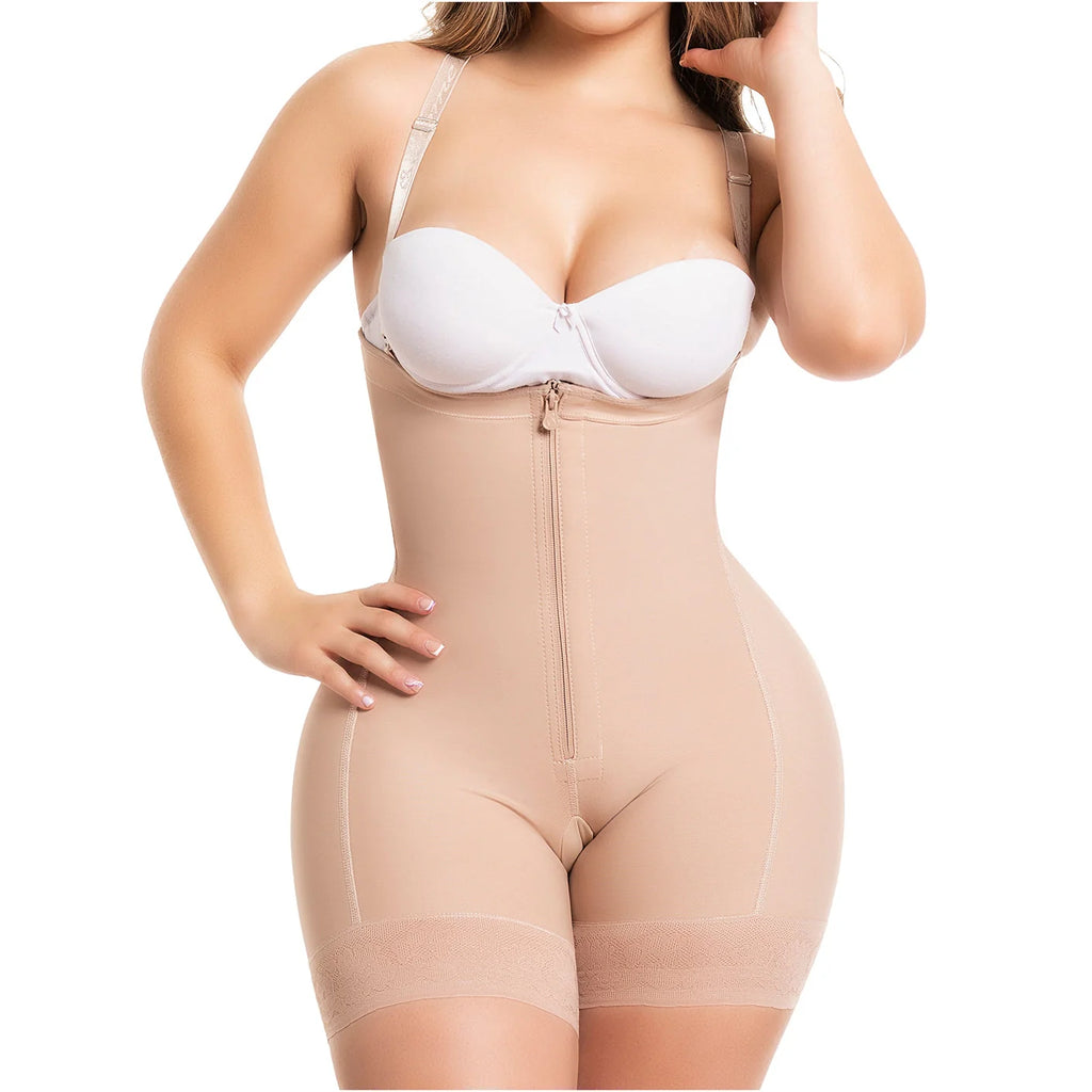 Beige full-body shapewear with front zipper and open crotch, worn with white bra, front view
