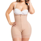 Beige full-body shapewear with front zipper and open crotch, worn with white bra, front view