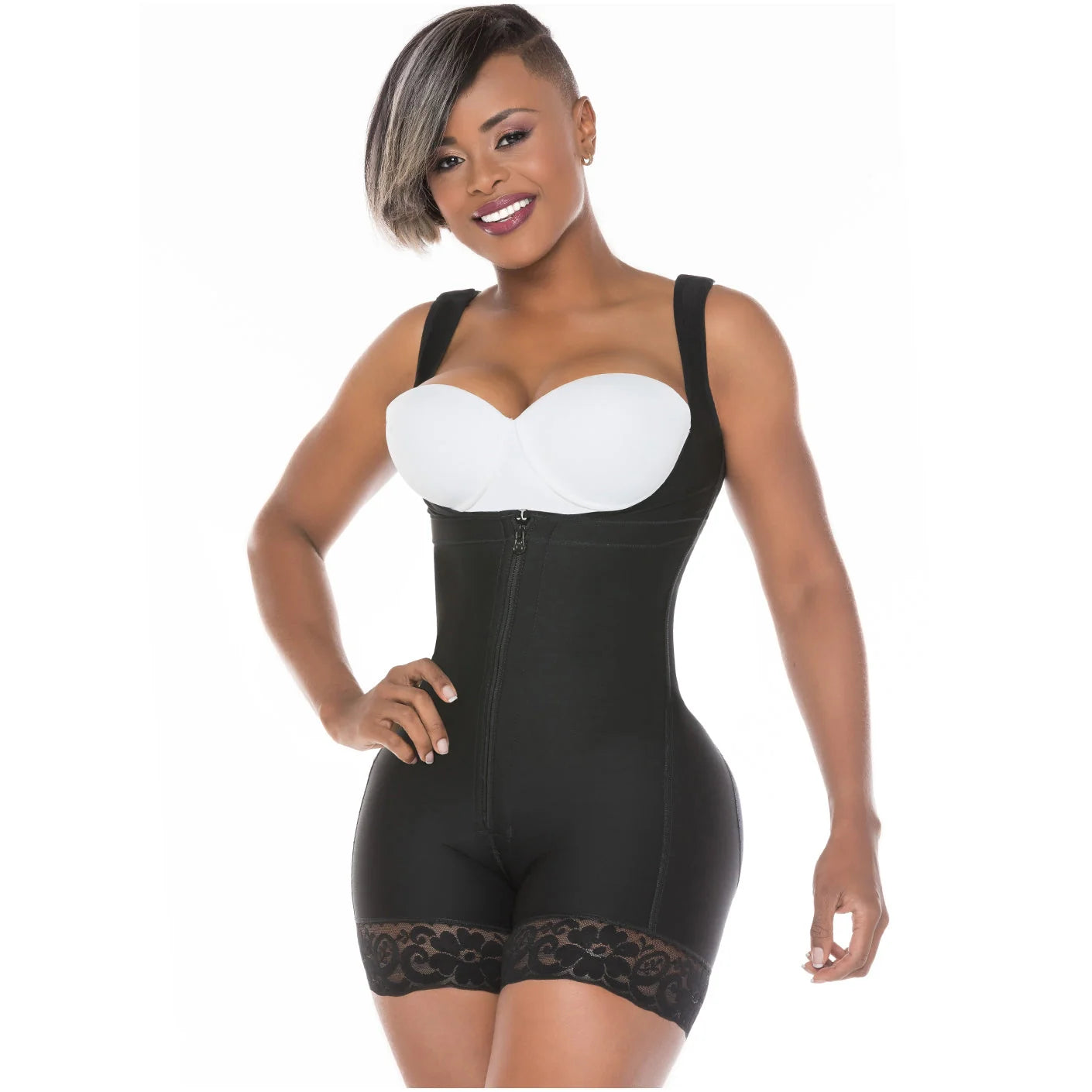 Black full-body shapewear with front zipper and lace trim, worn with white bra, front view