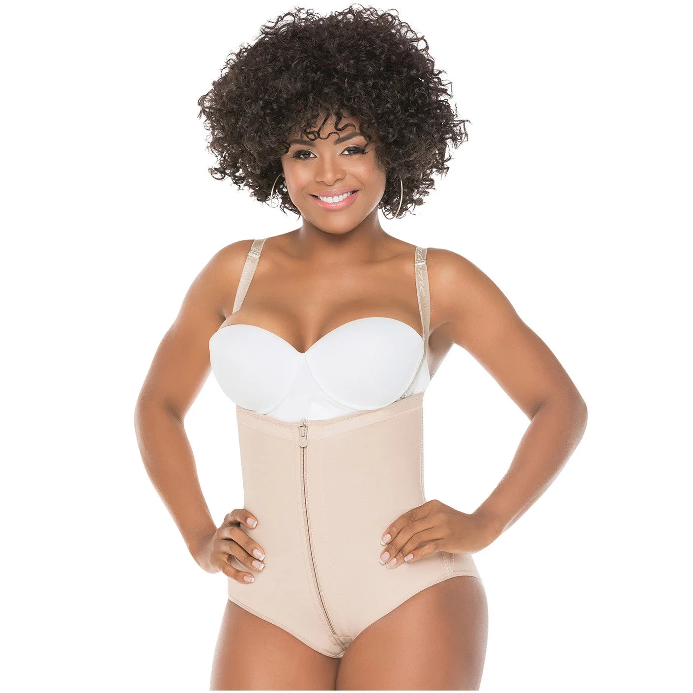Beige full-body shapewear with front zipper and open bust, worn with white bra, front view