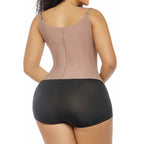Woman wearing a beige bodysuit with black underwear on a white background