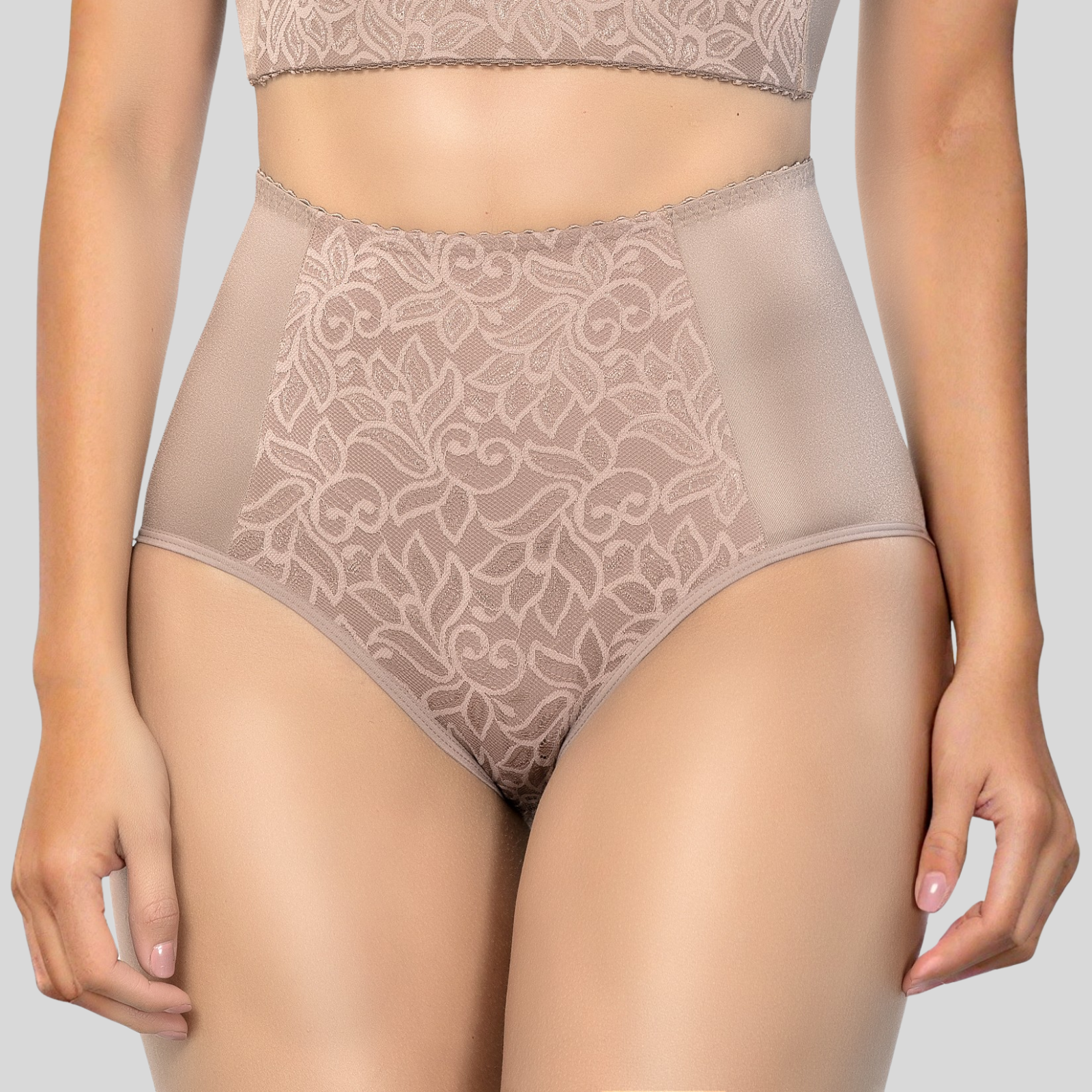 Beige lace lingerie set on a plain background