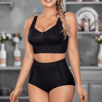 Woman wearing a black lace bra and panties set in a blurred kitchen setting