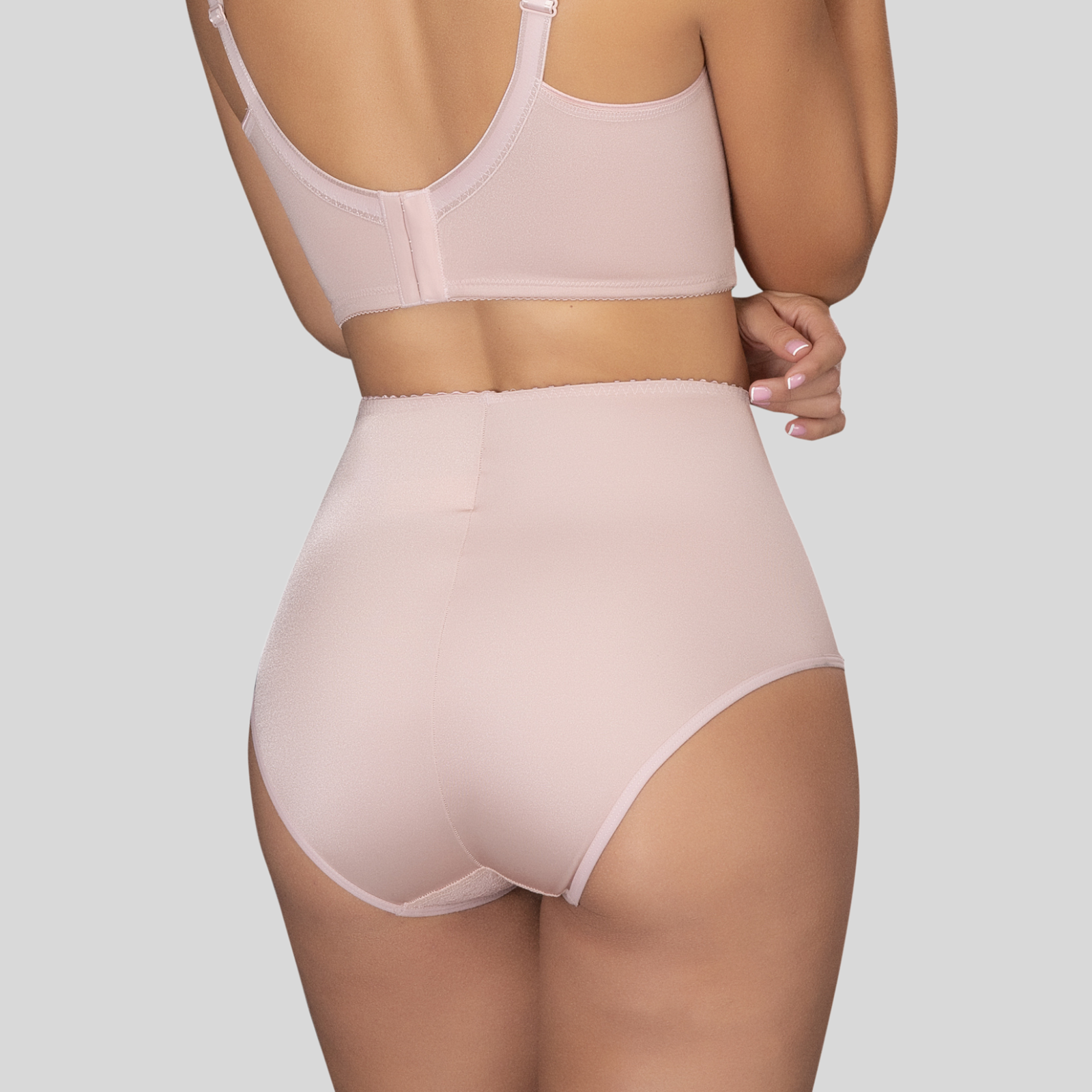 Pink shapewear set on a neutral background