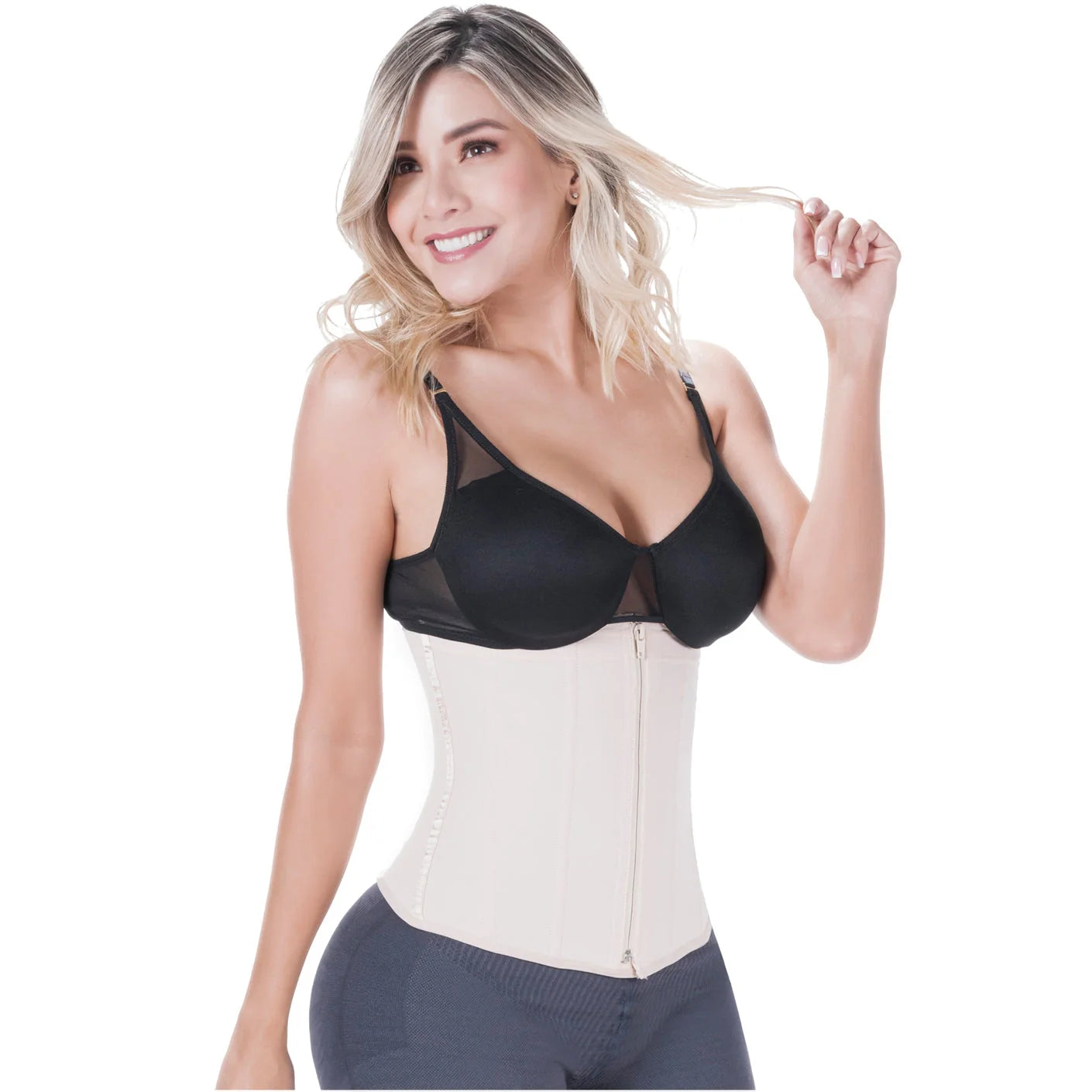 Woman wearing a black bra and white waist trainer on a white background